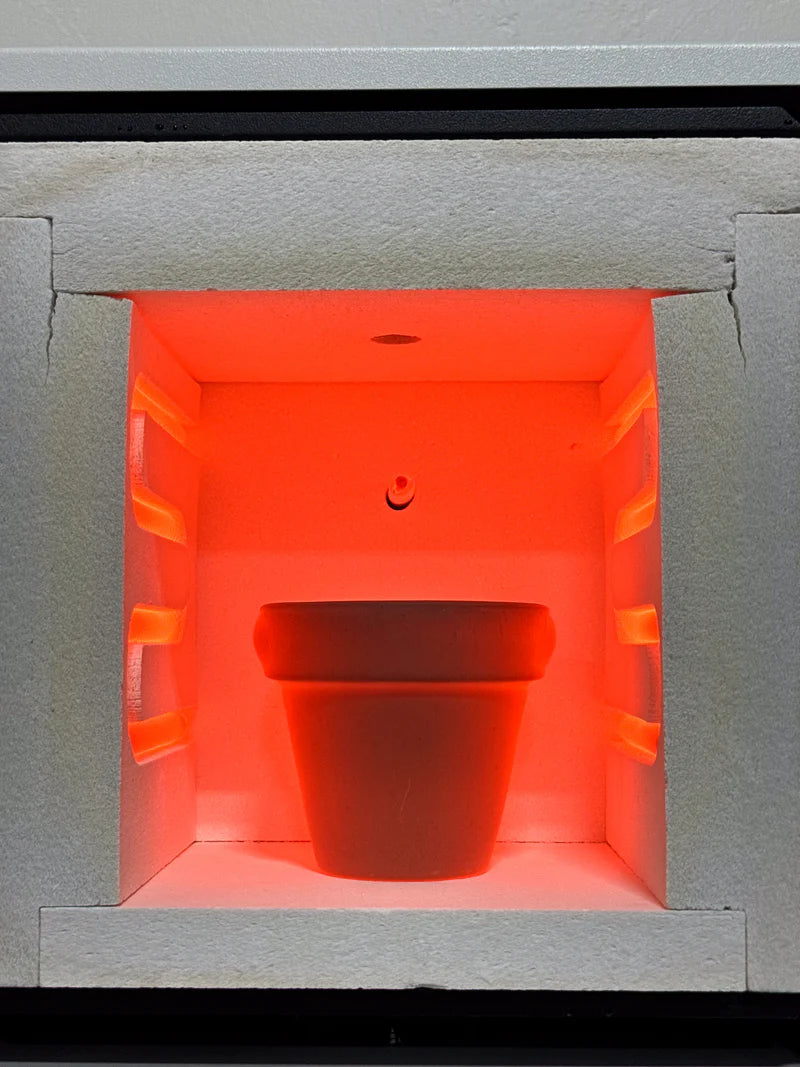 Hot Shot Vitrigraph kiln interior glowing with molten glass