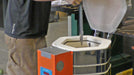 A blade being lowered into the chamber of a Jen-Ken Vertical Air Bath knife kiln