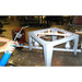 Olympic 2327G updraft gas kiln burner system being ignited with torch during setup